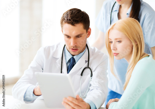 Photo: doctor and nurse with patient in hospital doctor and nurse with patient in hospital