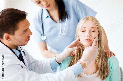 Photo: plastic surgeon or doctor with patient plastic surgeon or doctor with patient