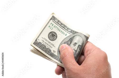 Photo: Hand holding a series of banknotes with 100 dollars on top Hand holding a series of banknotes with 100 dollars on top
