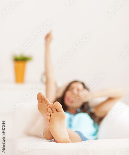 Photo: Young woman stretching after nap Young woman stretching after nap