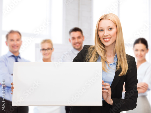 Photo: businesswoman with white blank board businesswoman with white blank board