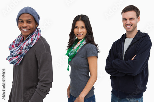 Photo: Stylish young people in a row looking happy Stylish young people in a row looking happy