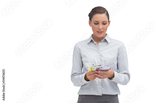 Photo: Businesswoman counting euro notes Businesswoman counting euro notes