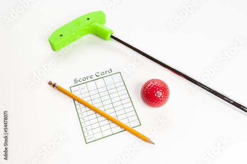 Photo: Green mini golf club with score card and ball Green mini golf club with score card and ball