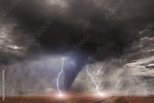 Photo: Tornado with lightning over a field Tornado with lightning over a field