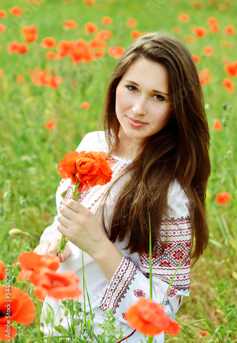 Photo: brunette girl in poppes field brunette girl in poppes field