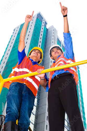 Photo: Asian architect and supervisor on construction site Asian architect and supervisor on construction site