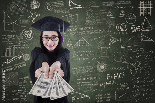 Photo: Asian female graduate giving money in class Asian female graduate giving money in class