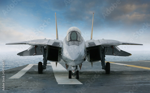 Photo: F-14 jet fighter on an aircraft carrier deck viewed from front F-14 jet fighter on an aircraft carrier deck viewed from front