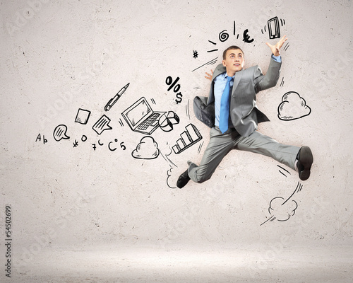 Photo: Jumping young businessman Jumping young businessman