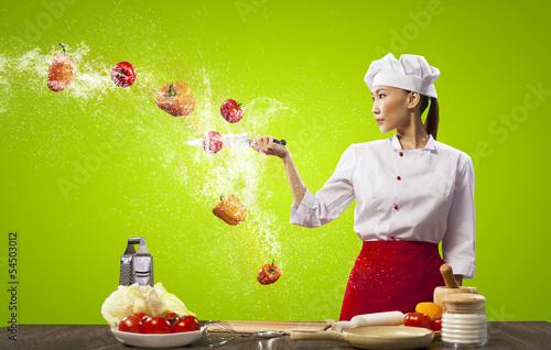 Photo: Asian female cook with knife Asian female cook with knife