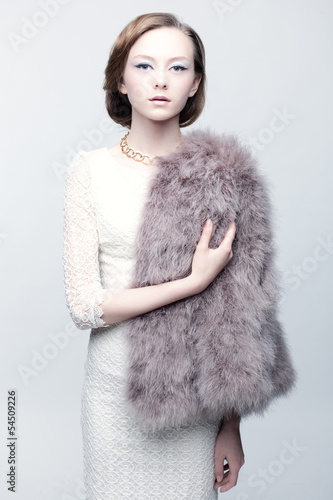 Photo: Vintage portrait of a young woman. Vintage portrait of a young woman.