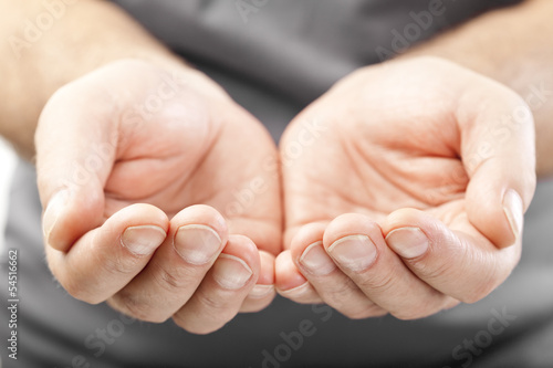 Photo: two male hands as if giving, showing or holding concept two male hands as if giving, showing or holding concept