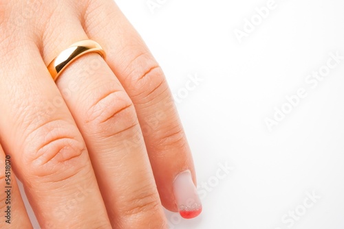 Photo: detail of one hand with gold ring with space for text detail of one hand with gold ring with space for text