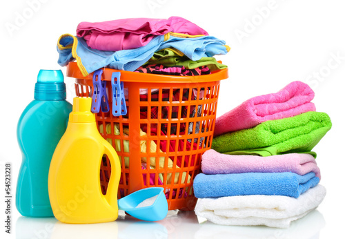 Photo: Clothes with detergent and washing powder in orange plastic Clothes with detergent and washing powder in orange plastic