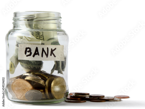 Photo: money on the bottle,dollar,isola ted on white background money on the bottle,dollar,isola ted on white background