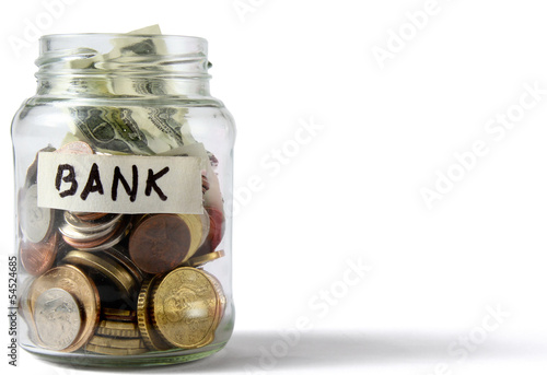 Photo: money on the bottle,dollar,isola ted on white background money on the bottle,dollar,isola ted on white background