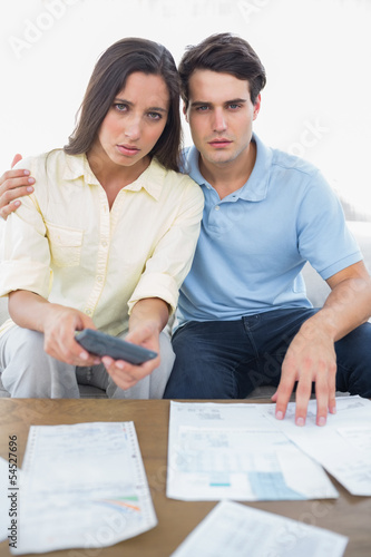 Photo: Worried couple doing their accounts Worried couple doing their accounts