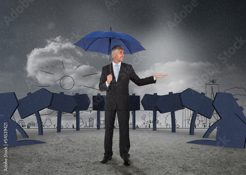 Photo: Businessman showing signs and a city Businessman showing signs and a city