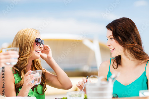 Photo: girls in cafe on the beach girls in cafe on the beach