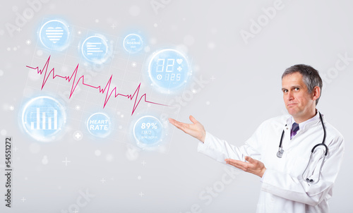 Photo: Doctor examinating modern heartbeat graphics Doctor examinating modern heartbeat graphics
