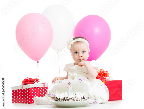Photo: baby girl with cake, balloons and gifts isolated on white baby girl with cake, balloons and gifts isolated on white