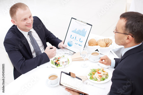 Photo: Discussing paper at lunch Discussing paper at lunch