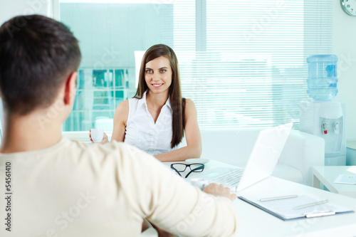 Photo: Secretary looking at boss Secretary looking at boss