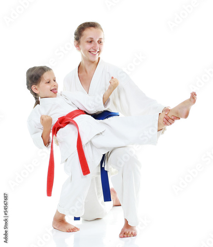 Photo: Two sisters, one teaches a sister beat kick leg Two sisters, one teaches a sister beat kick leg