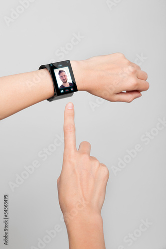 Photo: female wrist with a modern Internet Smart Watch female wrist with a modern Internet Smart Watch