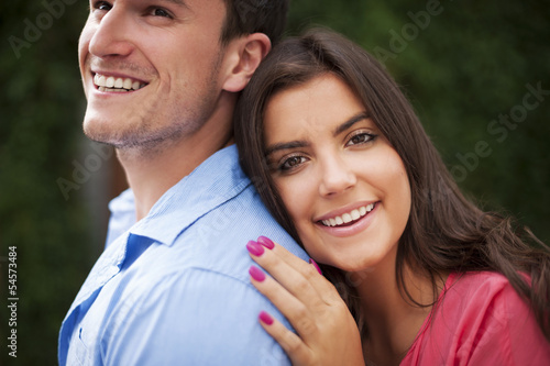 Photo: Portrait of beautiful and smiling couple Portrait of beautiful and smiling couple