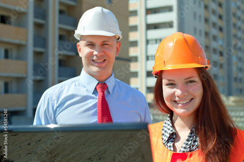 Photo: Portrait of two builders Portrait of two builders