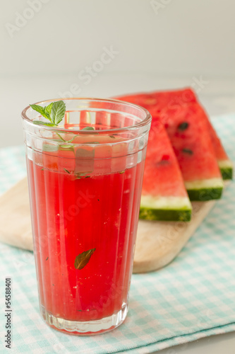 Photo: Glass of watermelon smoothie isolated on white. Glass of watermelon smoothie isolated on white.