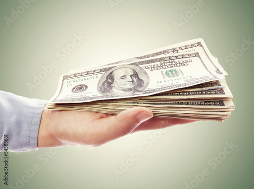Photo: Hand Holding Pile of Cash Hand Holding Pile of Cash