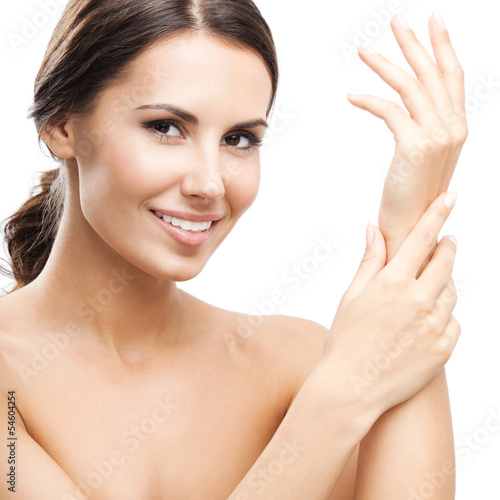 Photo: Woman touching skin or applying cream, isolated Woman touching skin or applying cream, isolated