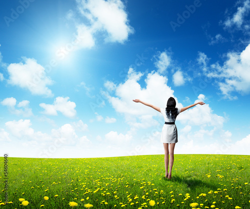 Photo: field of grass and happy young woman field of grass and happy young woman
