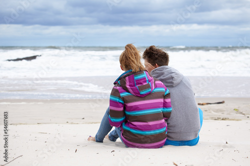 Photo: happy pair of male and female embracing and having fun wearing w happy pair of male and female embracing and having fun wearing w