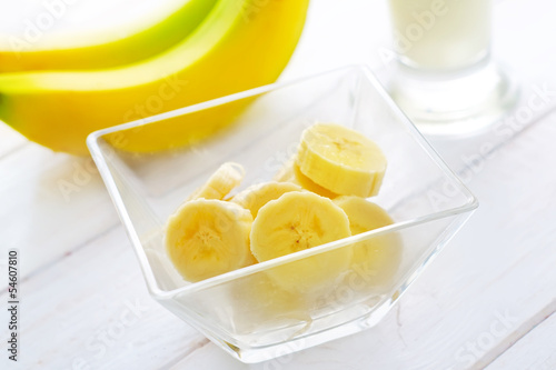 Photo: Fresh banana in the glass bowl, banana and milk Fresh banana in the glass bowl, banana and milk