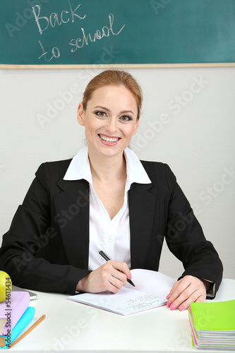 Photo: Portrait of teacher woman working in classroom Portrait of teacher woman working in classroom