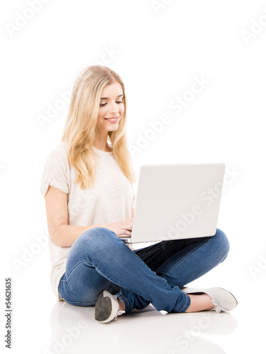 Photo: Woman working on a laptop Woman working on a laptop