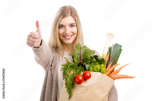 Photo: Beautiful woman carrying vegetables Beautiful woman carrying vegetables