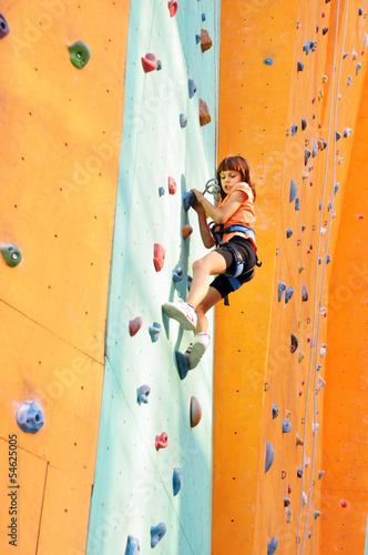 Photo: child climbing up the wall child climbing up the wall