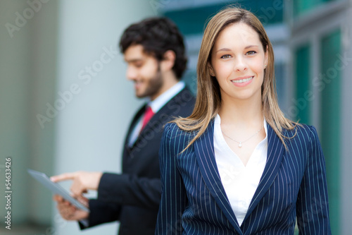 Photo: Smiling businesswoman outdoor Smiling businesswoman outdoor