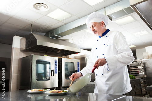 Photo: Professional chef at work Professional chef at work