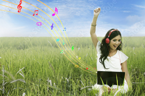 Photo: Happy woman singing on field Happy woman singing on field