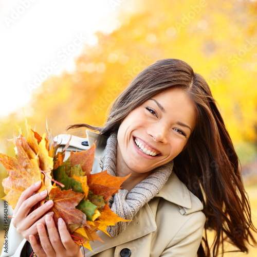 Photo: Autumn / Fall woman holding colorful leaves Autumn / Fall woman holding colorful leaves