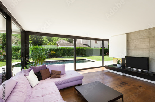 Photo: Modern villa, interior, wide living room with pink divan Modern villa, interior, wide living room with pink divan
