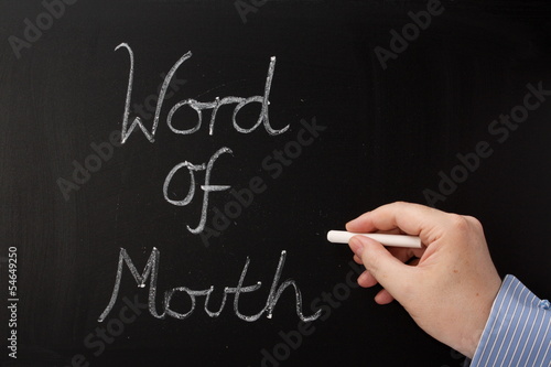 Photo: Writing Word of Mouth on a Blackboard Writing Word of Mouth on a Blackboard