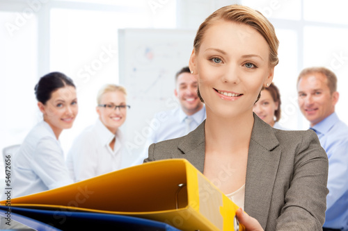 Photo: woman with folders in office woman with folders in office