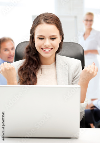Photo: businesswoman with computer in office businesswoman with computer in office